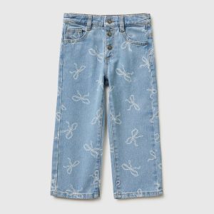Jeans slim fit estampa laços