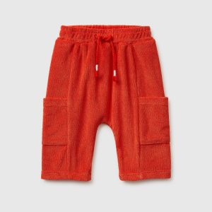 Calças em turco com bolsos